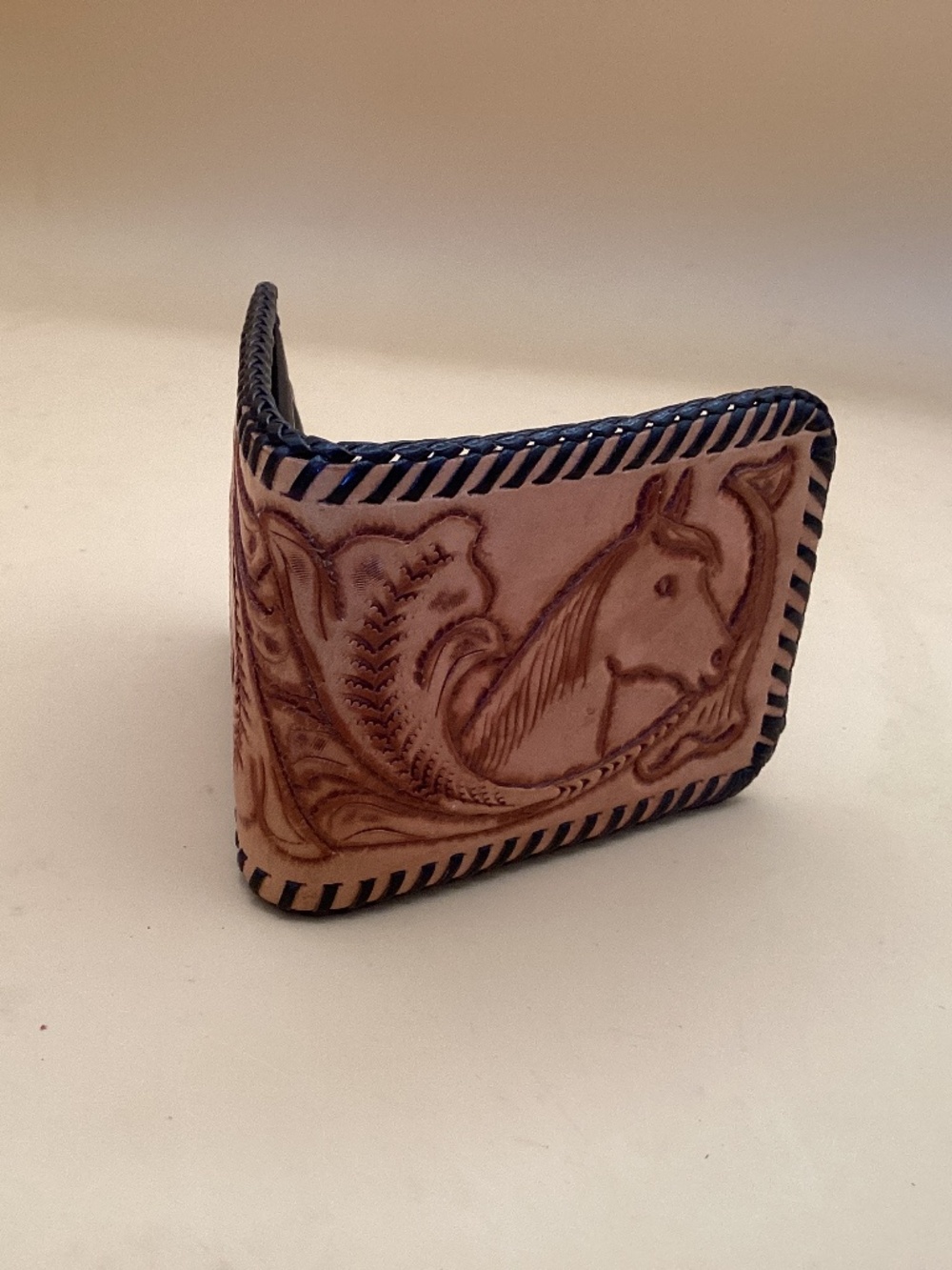 Veg handtooled leather wallet